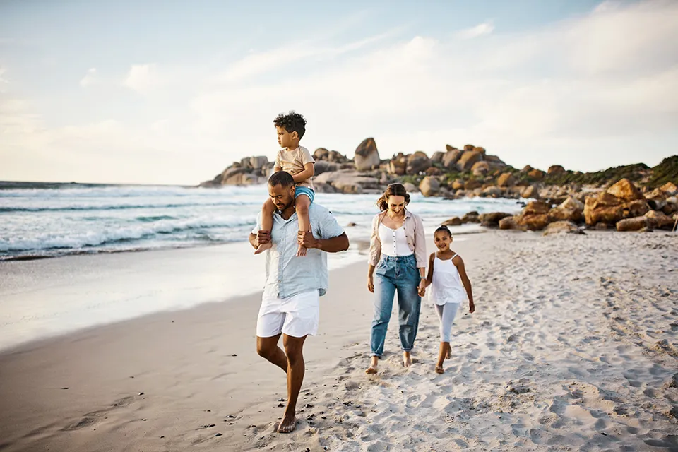 Family walking along a beach